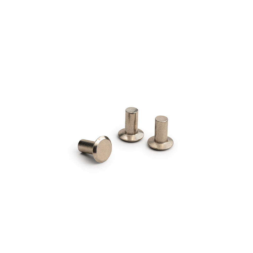 BYB0421A00000_NIKRIVET01XXXX_Brooks-England_1_solid-leather-saddle-rivets-kit-3-pcs-spare_parts.jpg